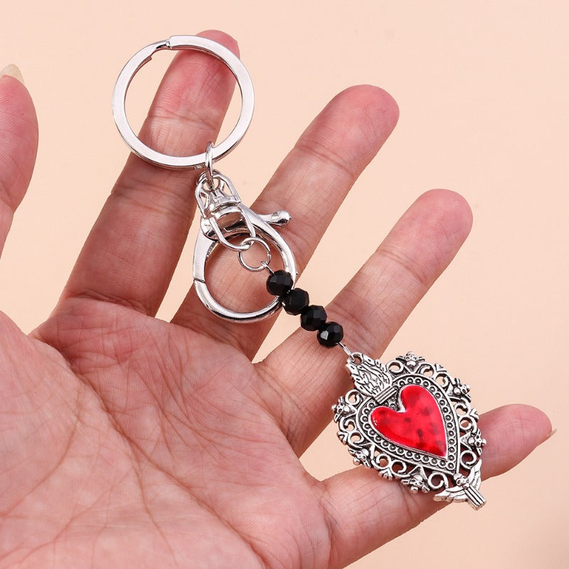 Wholesale Butterfly Cross Hollow Lace Love Devil Eyes Keychain